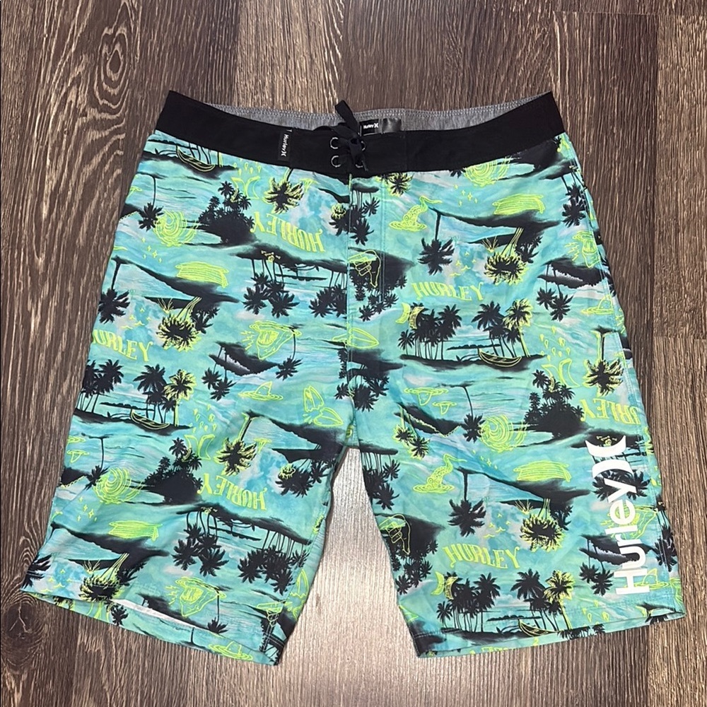 Hurley Boys swim trunks size 18/29 blue with palm tree design